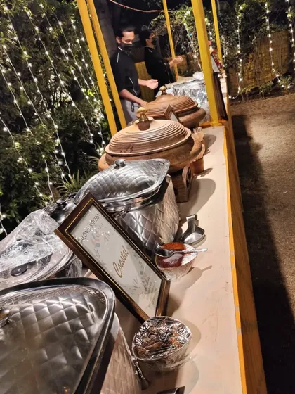 A shot of the buffet line at an outdoor Diwali party, with my team ready to serve guests.