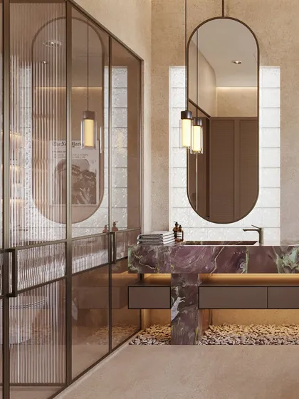 A fluted glass partition separates the main bathroom area from the toilet, providing privacy while allowing light to filter through.
