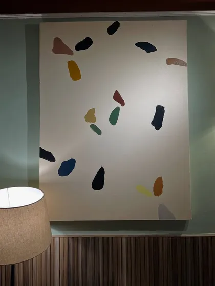This terrazzo-style painting was also part of the Kanpur cafe commission. The scattered, colorful shapes on a neutral background create a playful and modern look.