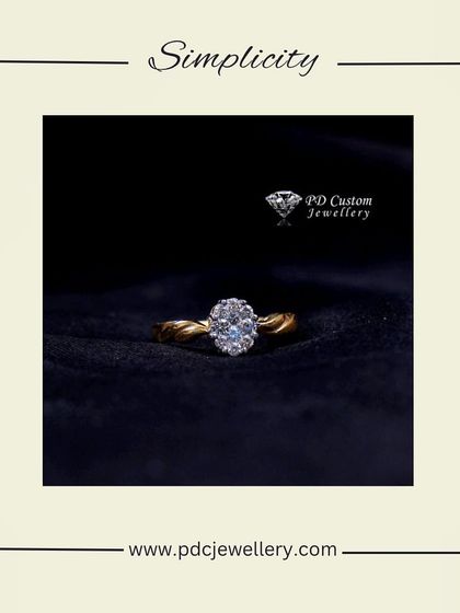 Simplicity and sparkle combined in this 18kt hallmarked gold and diamond ring. The twisted band enhances the brilliance of the oval-shaped diamond cluster.