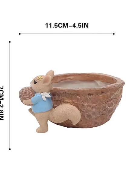 This image shows the dimensions of the squirrel nut pot, which is 4.5 inches wide and 2.8 inches tall. It's a compact and cute planter perfect for small spaces.
