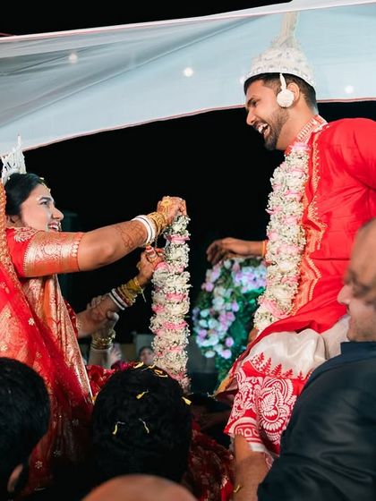 The Shubho Drishti ritual in a Bengali wedding. The joy on the couple's faces as they see each other for the first time is a moment of pure magic.