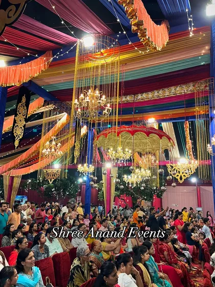 A wide shot of the audience at a large-scale cultural event, showing the massive, colorful tent and decor we provided.