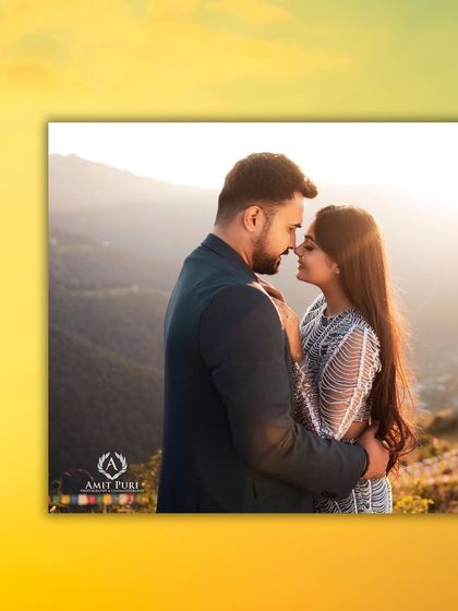 A perfect nose-to-nose kiss, silhouetted against the setting sun. This is a classic romantic shot, made even more beautiful by the stunning mountain landscape and golden light.