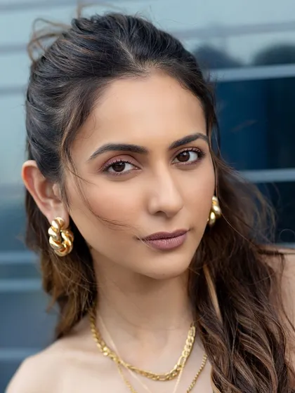 A close-up of Rakul Preet looking effortlessly chic in our braided beauty hoops. They are the perfect chunky yet elegant accessory.