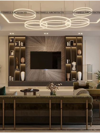 We designed this TV lobby for comfort and style. The focal point is the sunburst veneer pattern on the TV wall, flanked by illuminated bookshelves that provide a place for displaying art and personal treasures.