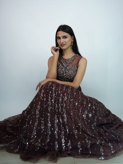 A beautiful seated portrait in a deep brown, sparkling gown. This is a great option for a formal evening reception or a pre wedding photoshoot.