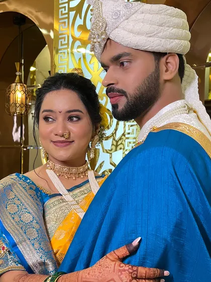A candid look between the couple. The bride's natural glow is enhanced, not covered.