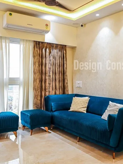This living room features a beautiful teal velvet sofa that adds a touch of luxury and color. We kept the rest of the decor minimal to let the statement furniture piece shine.
