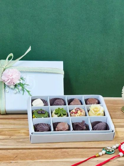 For the sibling who loves both tradition and chocolate, this box is the perfect mix. It features a selection of my ghee-free dry fruit mithai alongside rich, handmade chocolate pralines.
