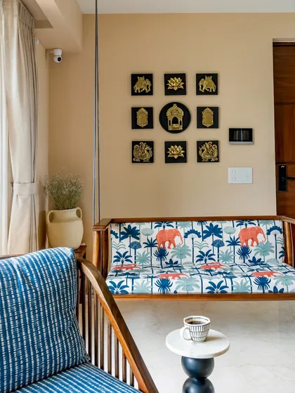 A cozy corner in our 'Project Lily' featuring a custom-made wooden swing with vibrant, patterned upholstery. This element adds a playful yet traditional touch to the modern living area, creating a perfect spot for relaxation.