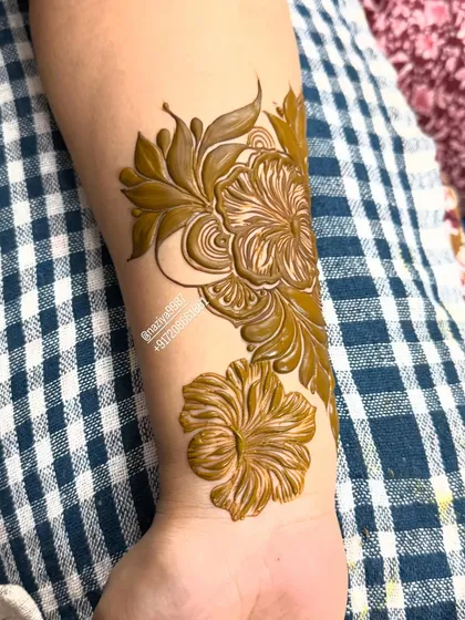 Here I've added a second flower to the design, creating a small but impactful floral piece on the wrist.