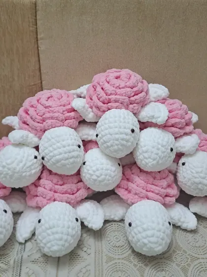 A big pile of my plush turtle soft toys. The combination of pink and white gives them a soft and gentle look.