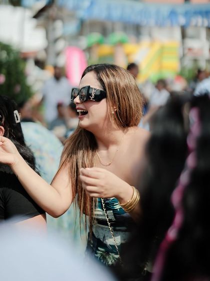 A candid shot capturing a moment of pure joy and laughter with the guests. These are the unscripted, genuine interactions that make a wedding feel warm and personal.