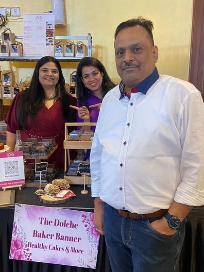 My family's support means the world to me. Here I am with a family member at my pop-up stall, feeling proud and grateful for their encouragement.