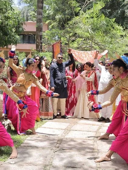 The bride's mother and maternal uncle ('mama') make their entrance for the Bhaat ceremony. I choreograph entries for all key family members to ensure everyone gets their special moment.