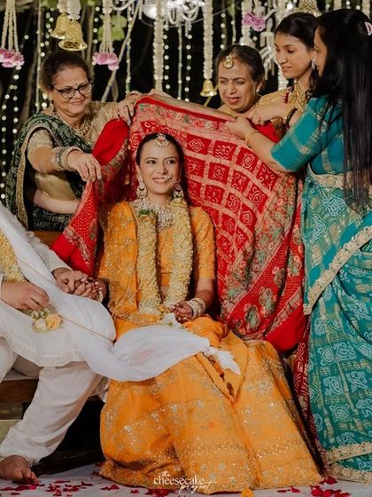 A traditional Gujarati wedding ritual, captured with all the family members involved.