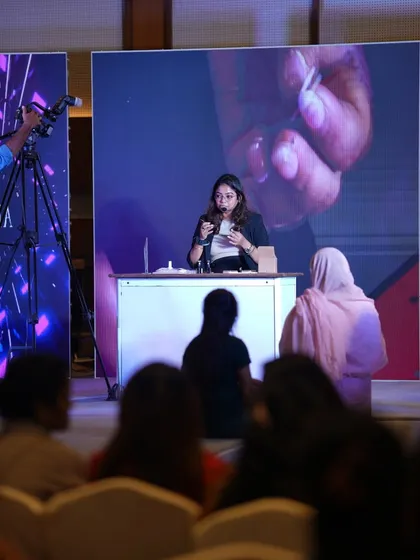 Sharing my passion and expertise is a huge part of what I do. Here I am on stage at the Kolkata Nail Competition, doing a live demo for fellow artists. It's moments like these that push the industry forward.