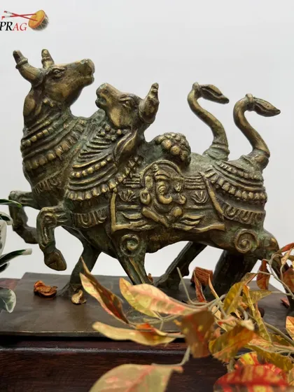 Our collection extends beyond paintings to include masterfully crafted sculptures. This antique-finish brass sculpture features the twin Nandis, symbols of devotion, alongside an intricately carved Lord Ganesha. It is a timeless expression of Indian spiritual philosophy and heritage craftsmanship.
