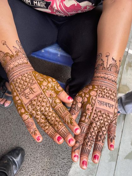 Another view of the special Rakhi mehandi design, showing how both hands come together. It's a beautiful way to celebrate the bond between brother and sister.