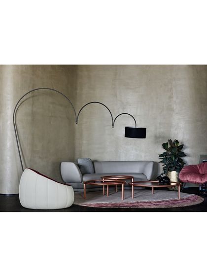 A living room setting we designed within the Ventura showroom. The space features a sculptural floor lamp and a mix of modern furniture to create an inspiring, home-like vignette for shoppers.