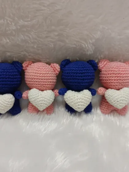 These couple bear dolls are great for gifting to friends or as party return favors. I love making them in pairs, like this set of pink and blue bears holding white hearts.