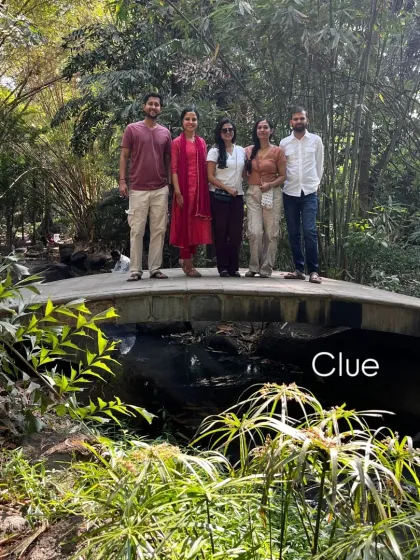 A beautiful group of us on a bridge surrounded by nature. Sometimes our yoga practice takes us outside the studio walls.