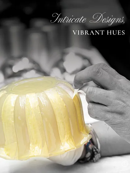 My glass jars are intricately engraved, molded, and varnished to give a look of sheer luxury. This is all made possible by generational artists who love making unique pieces. Here, an artisan carefully applies detailing to a Zen Lotus vessel.