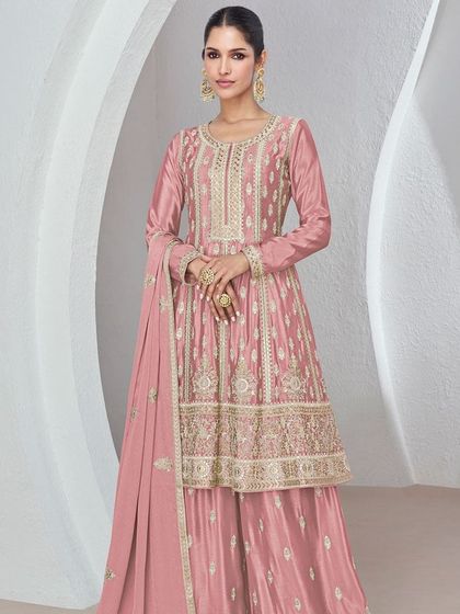 I love this onion pink Chinon silk palazzo suit for its soft, feminine vibe. The heavy thread and sequin work on the top makes it a standout piece for any festive occasion.