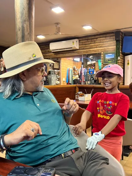 It's always a joy to see the next generation of golfers, like our youngest player here, falling in love with the game. My academy is a place for families and players of all ages to learn and grow together.