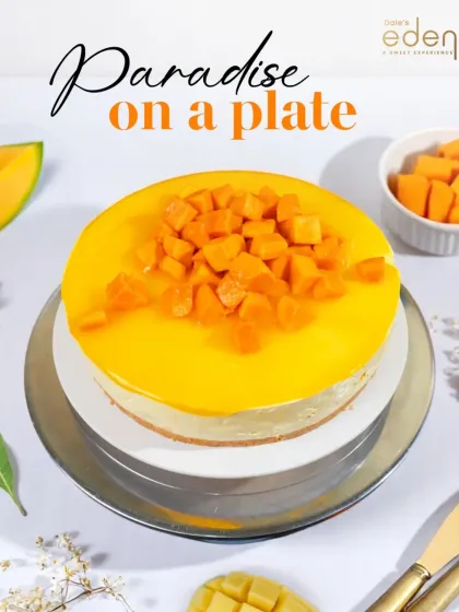Paradise on a plate. Our classic Mango Cheesecake features a creamy base and is topped with a vibrant mango glaze and fresh, diced fruit.