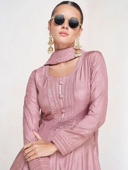 A lovely pink premium silk gown that's both simple and stunning. The thread embroidery and sequin work are focused on the yoke, creating a balanced and elegant look.