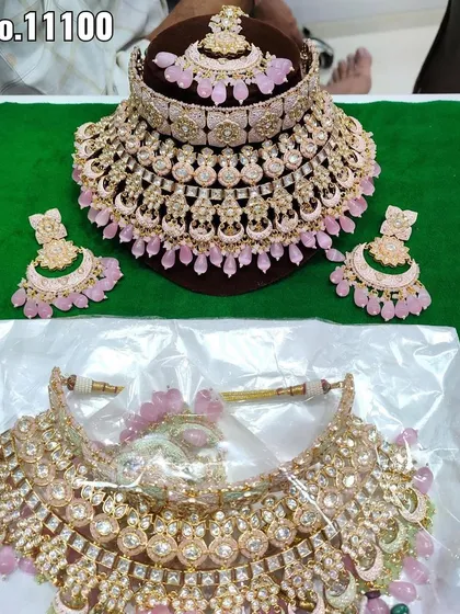 A collage of two different grand pink choker sets. These are statement rental pieces perfect for a bride's reception or a close family member.