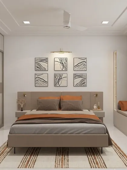 This bedroom design uses a calming palette of beige and taupe, creating a soft and neutral base. The layout includes a long window seat for lounging, and a six-panel art display above the bed adds a touch of modern elegance.