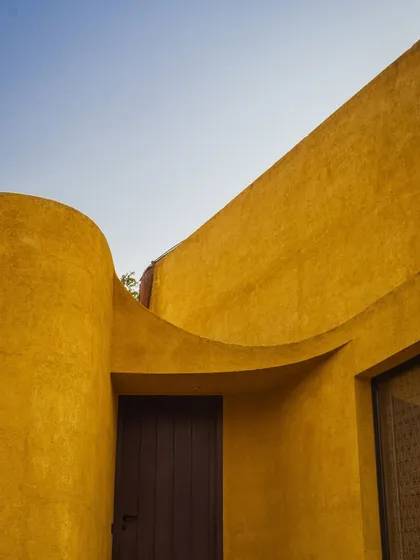 The gentle curve of the entranceway, designed to feel like an embrace, welcoming you into a space of peace.