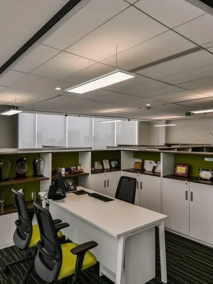 When senior management moves from private cabins to cubicles, privacy is still a key consideration. We designed these workstations with higher partitions and integrated storage to provide a sense of enclosure.