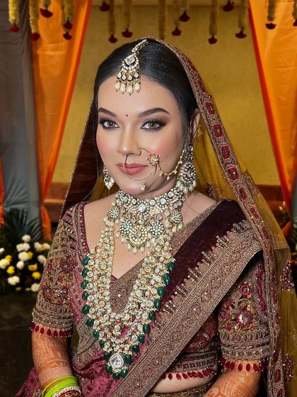 A still shot of this regal bride. The makeup is classic and sophisticated, with a focus on flawless skin and beautifully defined eyes.