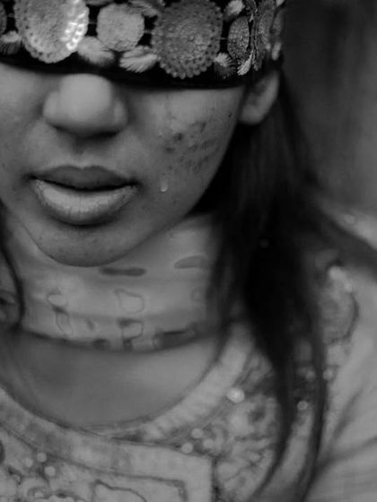A black and white close up of a young woman's emotional face during a wedding ritual, capturing the depth of feeling that surrounds a wedding.