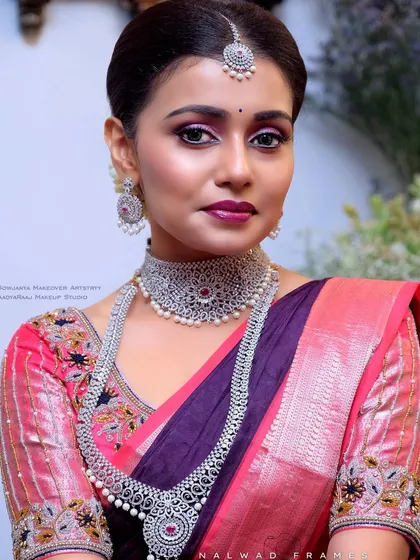 A stunning close-up of the silver-finish choker and haram. The intricate design and pearl details make this a truly special set.