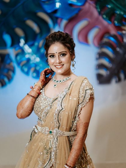 A joyful smile from the bride, ready for her big performance. We ensure our brides are relaxed and happy, knowing every detail is taken care of.