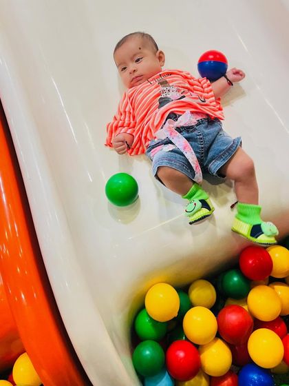 This baby is having a ball, literally. Our play zones are safe for even the youngest children to explore.