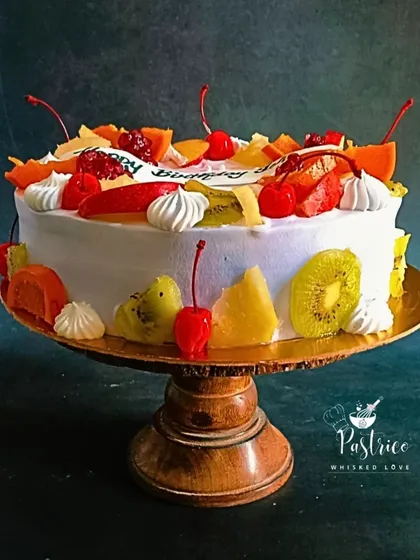 A celebration of freshness, my Exotic Fruit Cake is loaded with seasonal fruits like kiwi, orange, and pomegranate over a light vanilla sponge. It's a wonderfully light and refreshing option for any occasion.