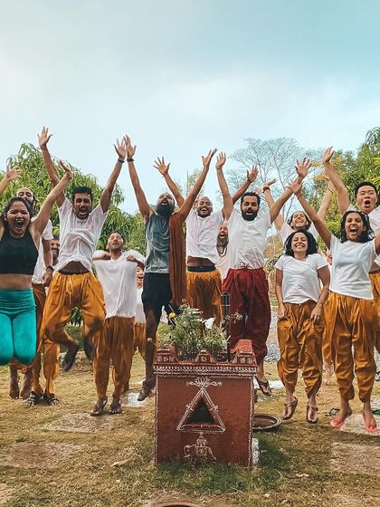 The exhilarating feeling of community and success. A group jump captures the high energy and shared joy of completing a challenging and rewarding journey together.