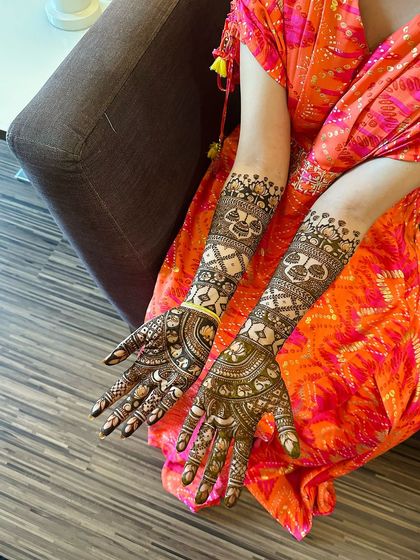 A full view of the previous design, showing the geometric patterns on the arms that complement the detailed palms.