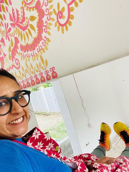 A happy moment during a long day of painting. My colorful shoes and apron are my trusty companions for every mural project. This was a special project, and I'm so glad I pushed through my fear to create it.