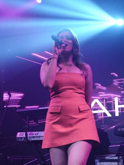 Singing under the spotlight. A great shot capturing the mood and lighting of my stage shows.