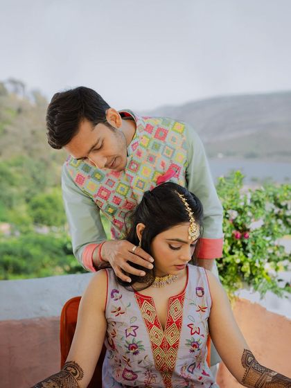 An intimate and caring moment between the couple during their Rajasthan pre-wedding session.