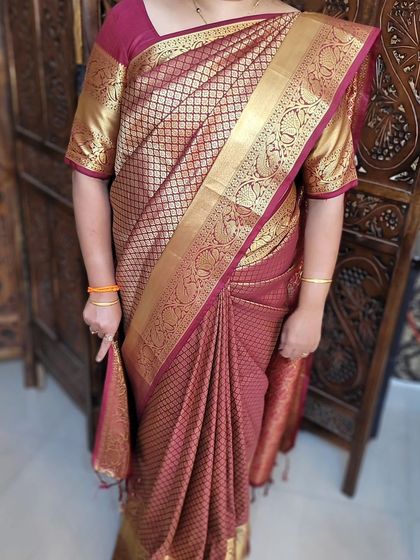 A proud student, Aditi, showing her perfectly self-draped silk saree after a 90-minute private session.