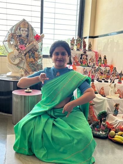 Celebrating the second day of Navratri by paying obeisance to Brahmacharini. Here I am in front of our family's Golu display, using mudras to symbolize the Japamala and Kamandal she holds.