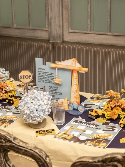 A wider view of the construction-themed table, showing how all the custom elements come together to create a fun and immersive dining experience.